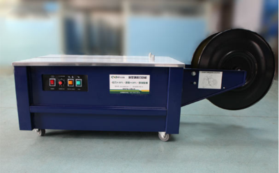 半自动低台打包机：广州番禺现货供应半自动低台打包机电动纸箱捆扎机QXD-02